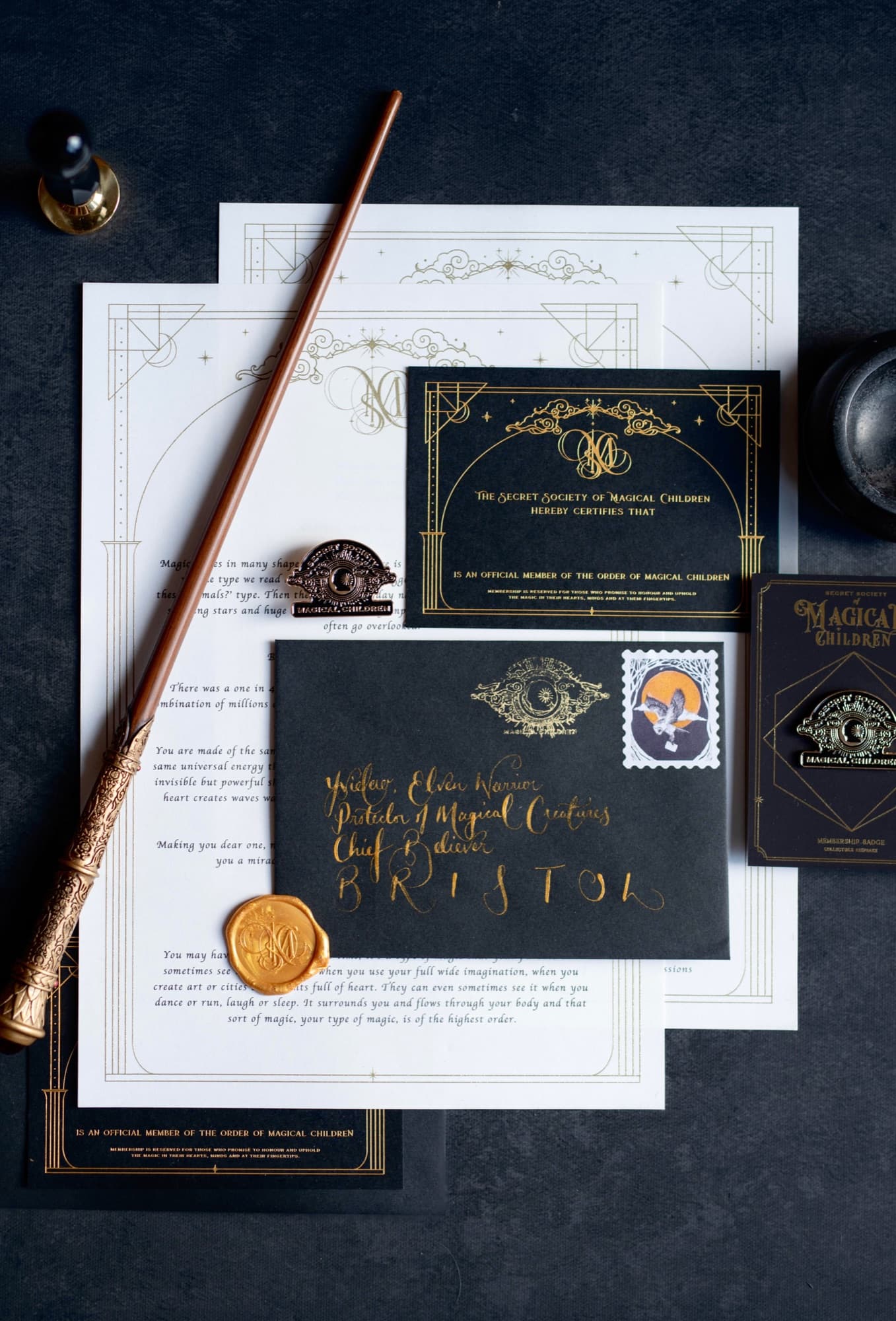 A Secret Society of Magical Children letter, membership card and envelope